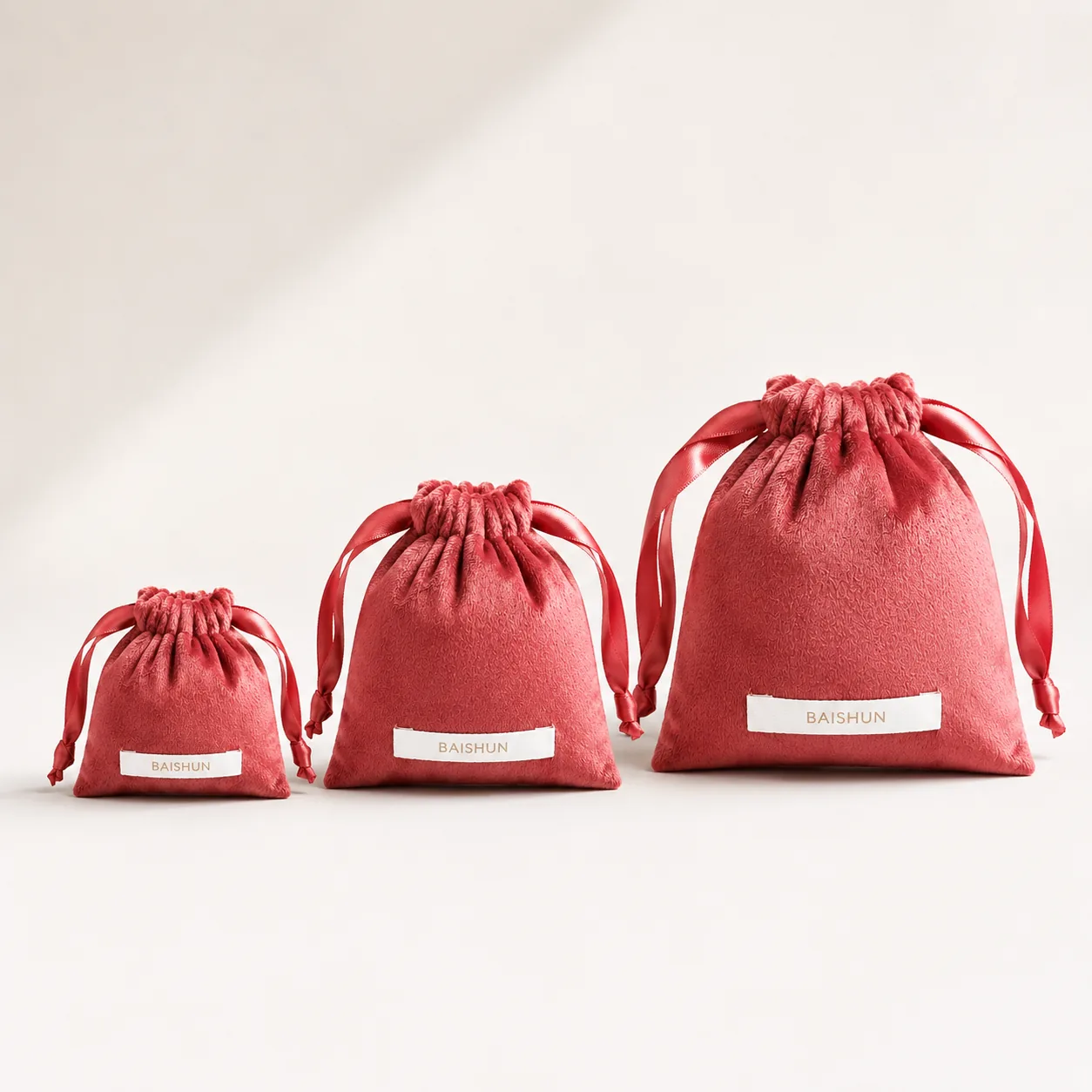 Coral Velvet-Look Woven-Label Pouch — main product view